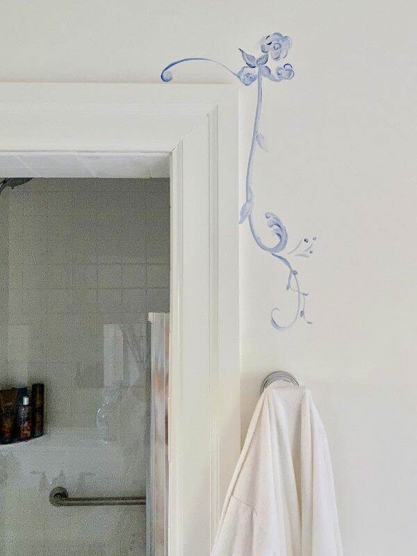 Sweet hand painted images in pool house bath