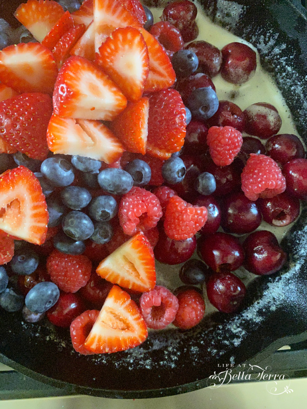 Fresh berries baked with an oatmeal topping in a skillet